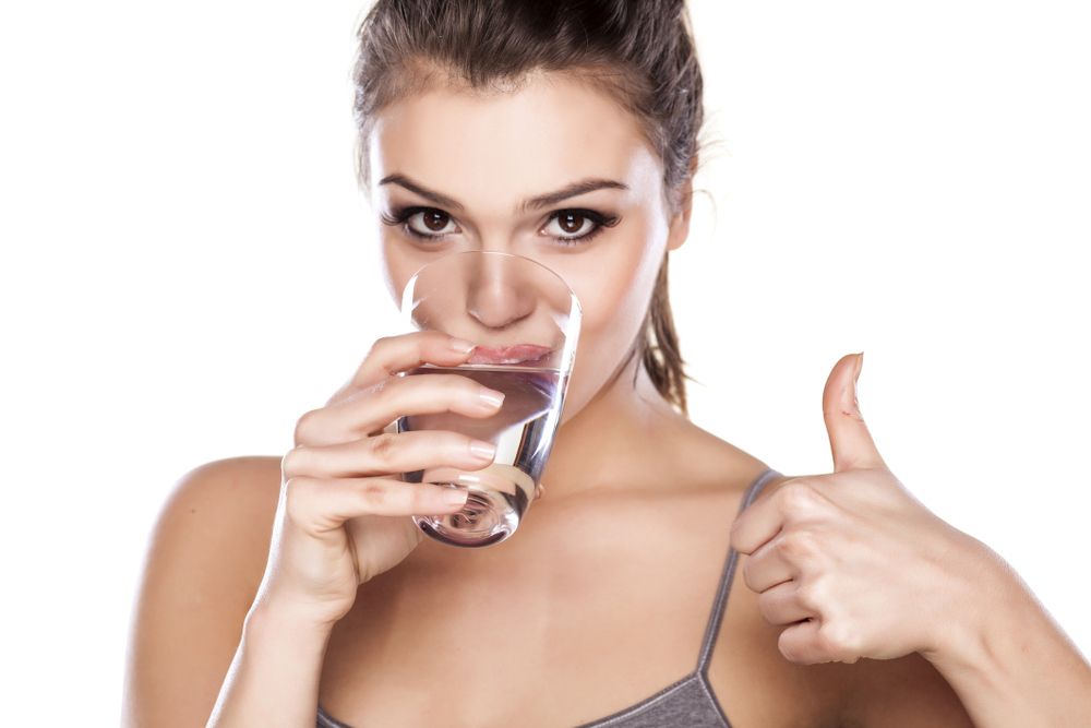 woman-drinking-water-gives-thumbs-up-188a94edff37fc4603609f91512d0cd2.jpg