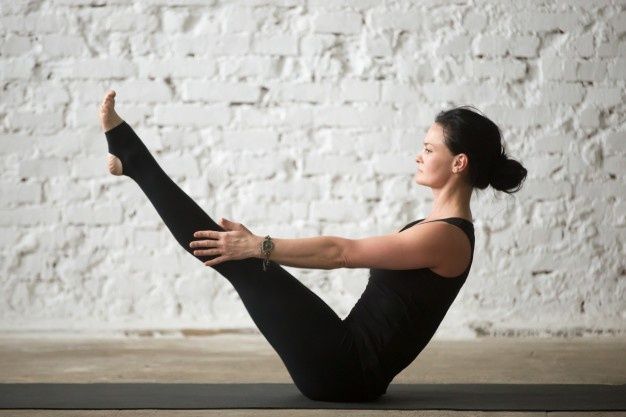 These 9 Yoga Movements Can Help You Shrink Your Stomach