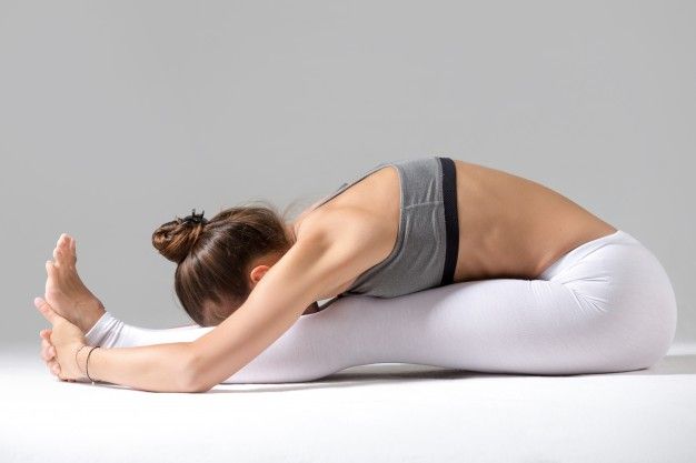 These 9 Yoga Movements Can Help You Shrink Your Stomach