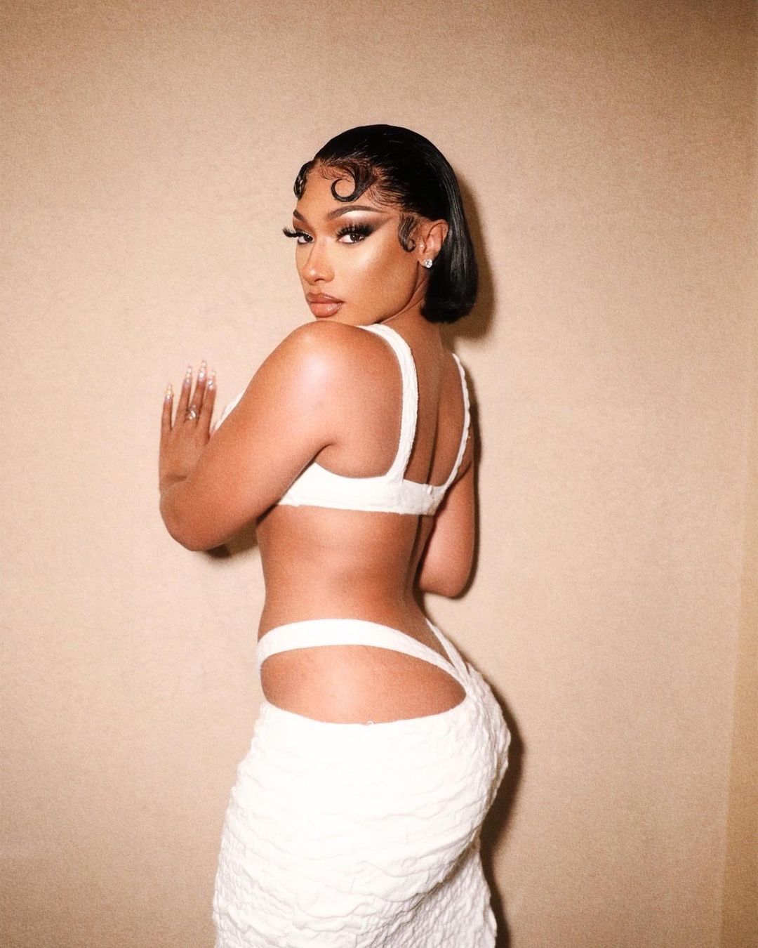 Megan Thee Stallion showed her signs while visiting Japan